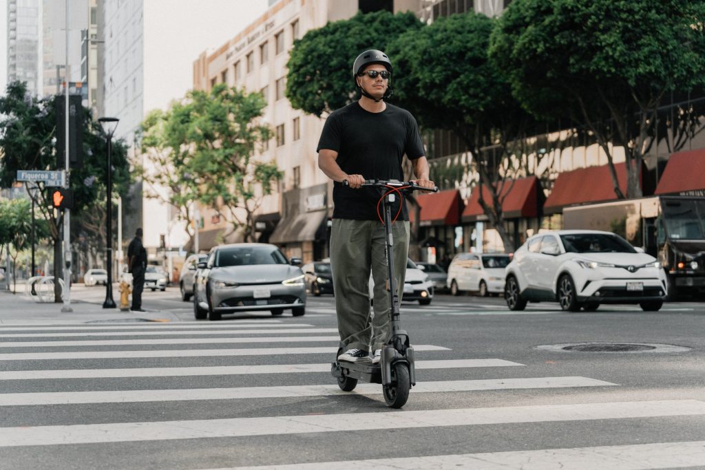 Rider waiting at a crosswalk on a Segway MAX G3 Plus electric scooter
