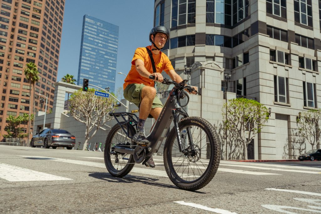 Commuter riding a Segway Xafari e-bike through the city