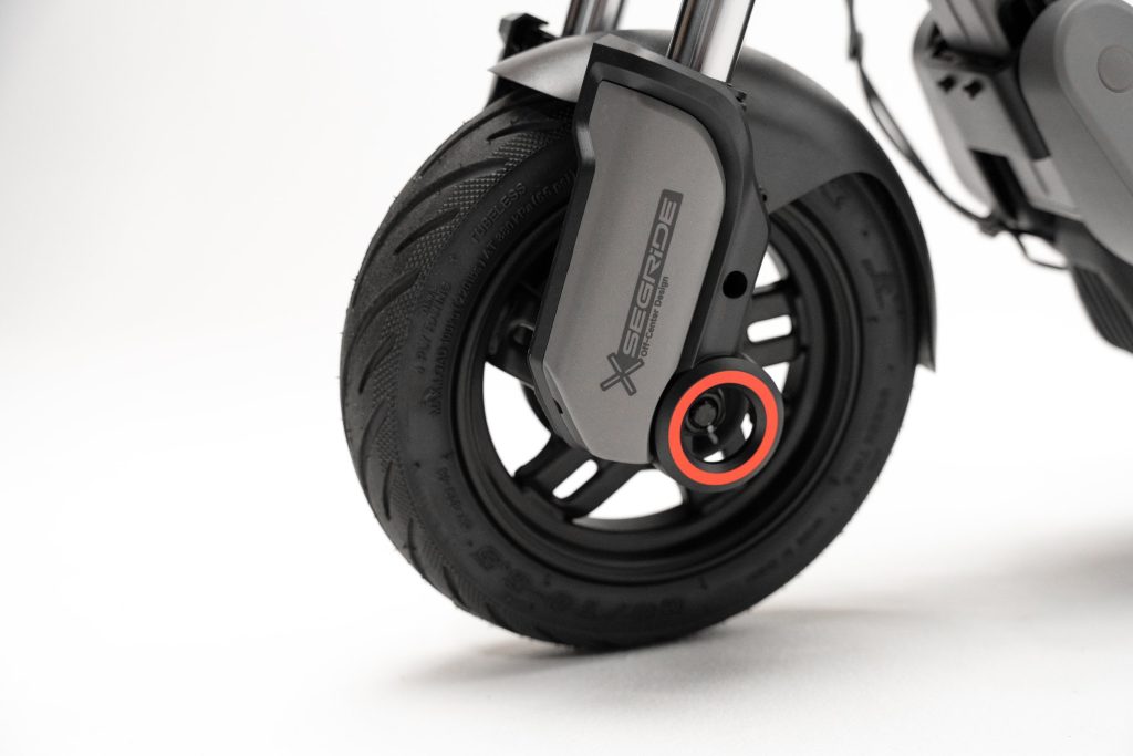 Front wheel and dual coil suspension of the Segway E3 Go electric scooter