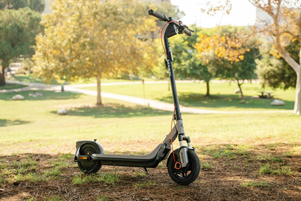 Segway E3 Go electric scooter parked on the grass in a park