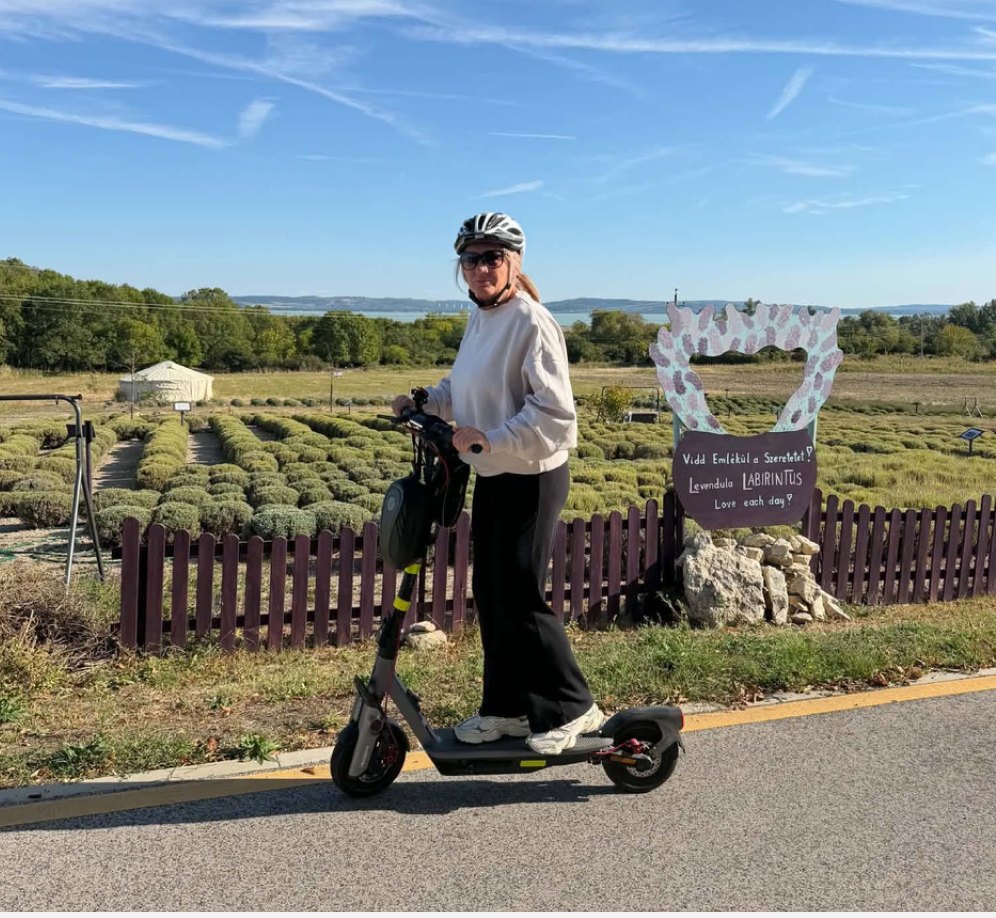 Rider with a Segway F3 Pro electric scooter near a lavender field at Lake Balaton, Hungary