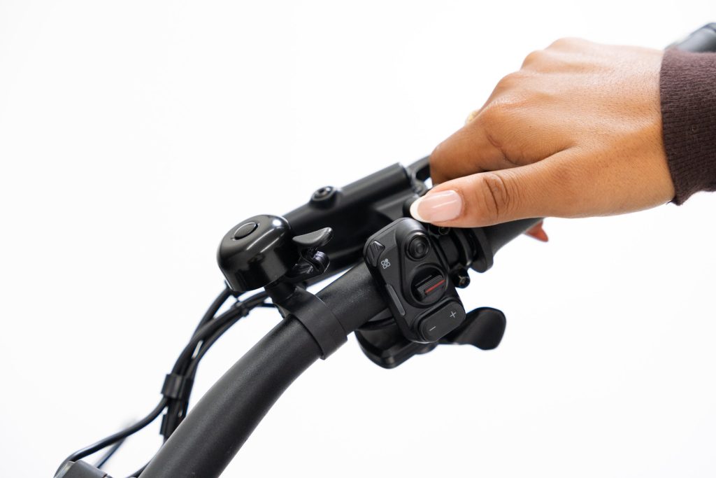 Rider pressing the handlebar control button assigned to the Segway Xiro dropper post