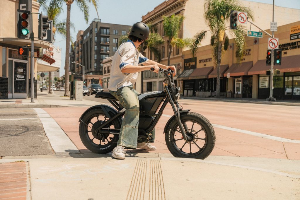 Rider sitting on a Segway Xyber Air eBike at a city crosswalk