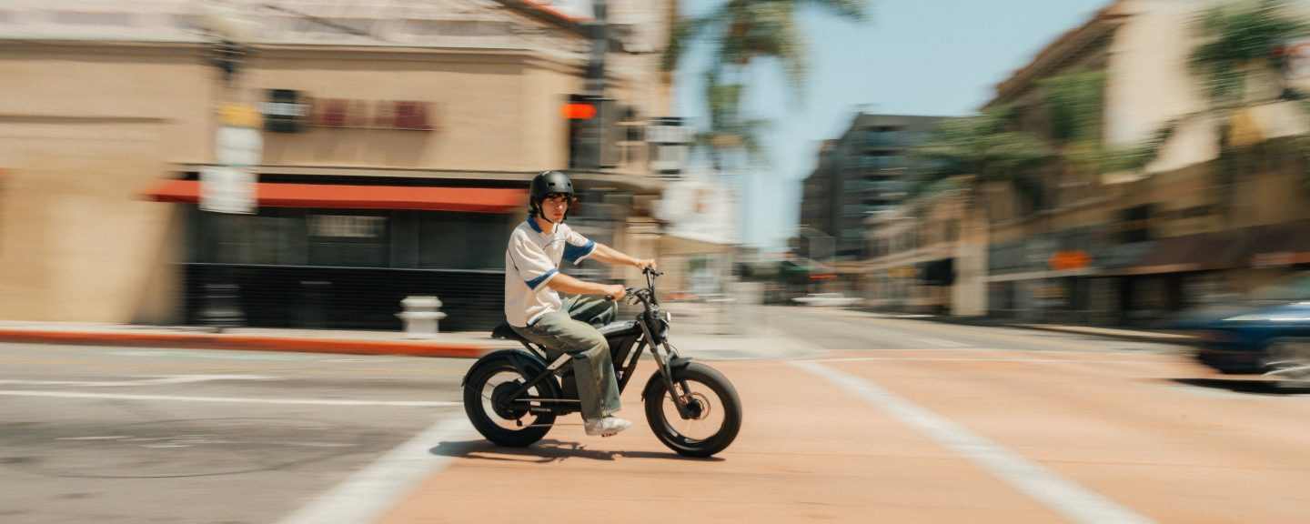 Rider on a Segway Xyber Air eBike crossing a city intersection